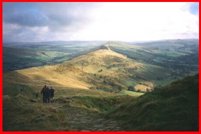 Walking down hill from the top of Mam Tor towards Hollins Cross.